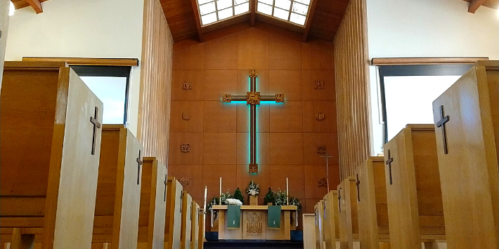 Image of the inside of the church showing the cross right in the middle of the temple